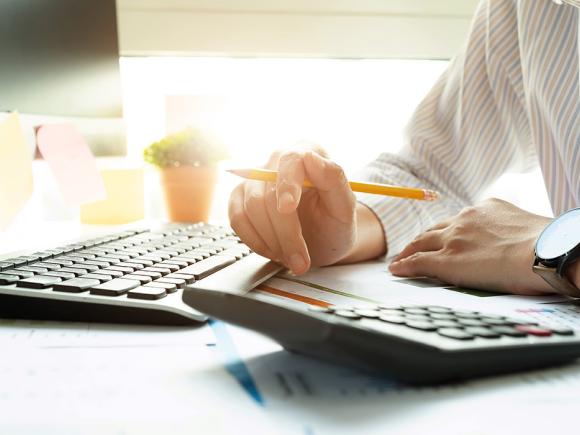 holding a pencil using a calculator