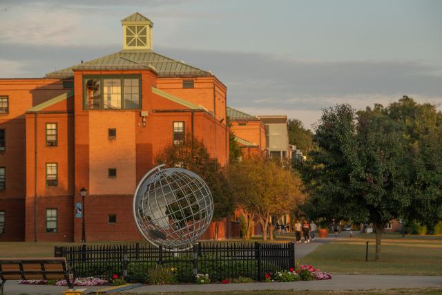 Campus globe in front of Courtney Hall.