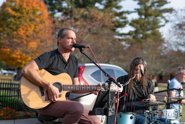 Musician singing at Family Weekend.
